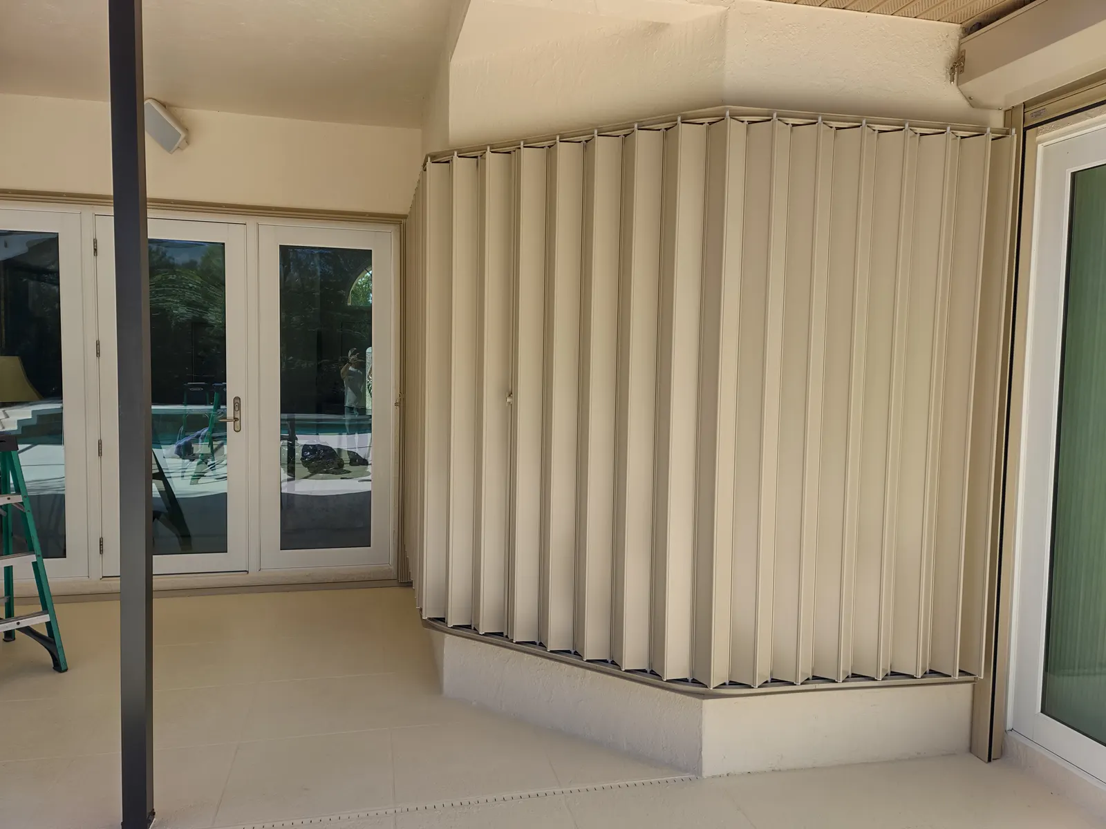 Accordion hurricane shutters installed on a Sarasota home